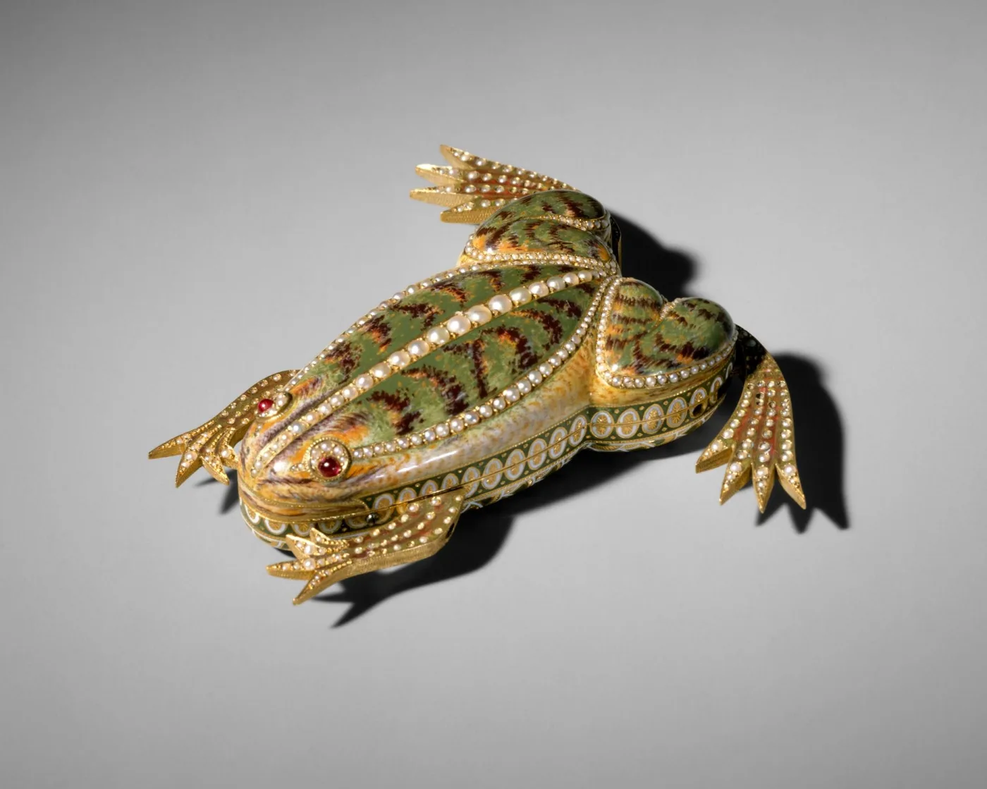 Automaton modelled as a fish, its articulated gold body set with rows of coloured stones and enamel scales, with jewelled fins and a segmented tail