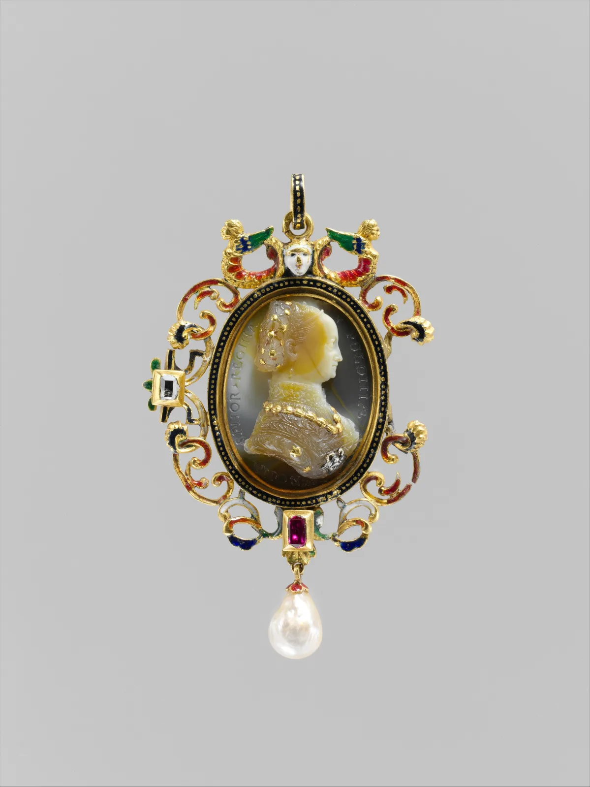 Gold pendant with enamelled openwork scrollwork, a table-cut diamond, a ruby and a hanging baroque pearl, its centre set with a banded agate cameo bust of a crowned woman in profile with gilded highlights and an incised inscription around the ground