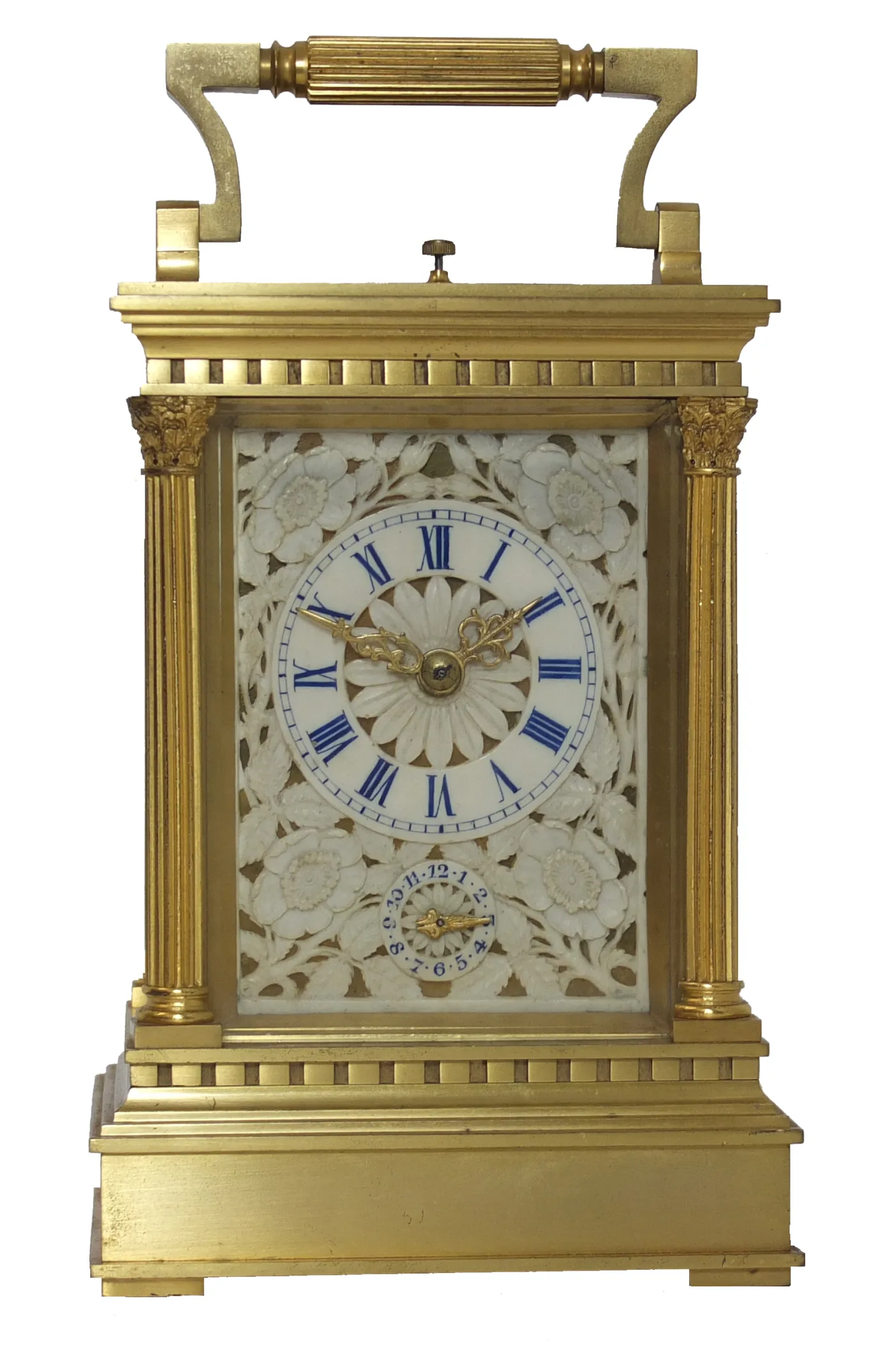 Gilt-bronze carriage clock with fluted corner columns, foliate capitals, dentil mouldings and a pierced carved ivory dial panel with blue Roman numerals