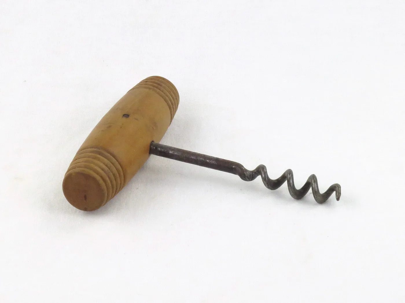 Direct-pull corkscrew with a plain ribbed cylindrical handle in a pale cream material, on a steel shank with a twisted worm