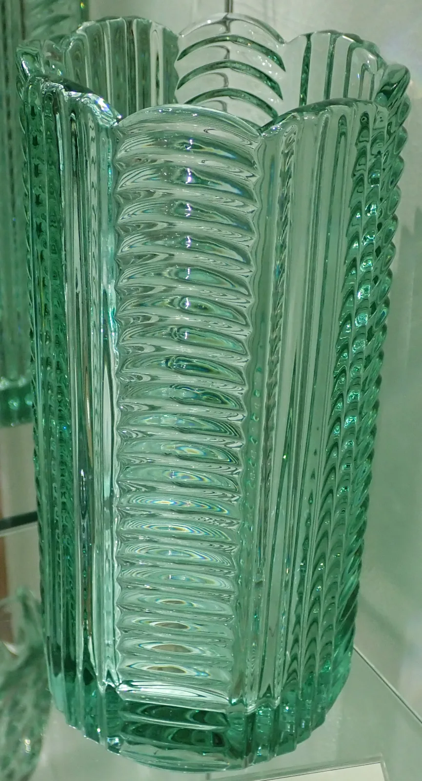 Pale blue-green pressed glass vase with heavy vertical ribbing and a squared profile