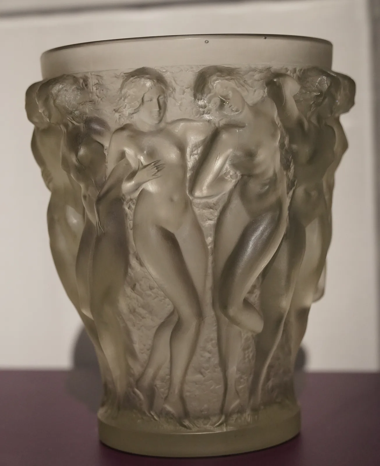 Heavy cylindrical glass vase moulded in deep relief with a continuous frieze of standing female nudes, the figures frosted against a smoother ground