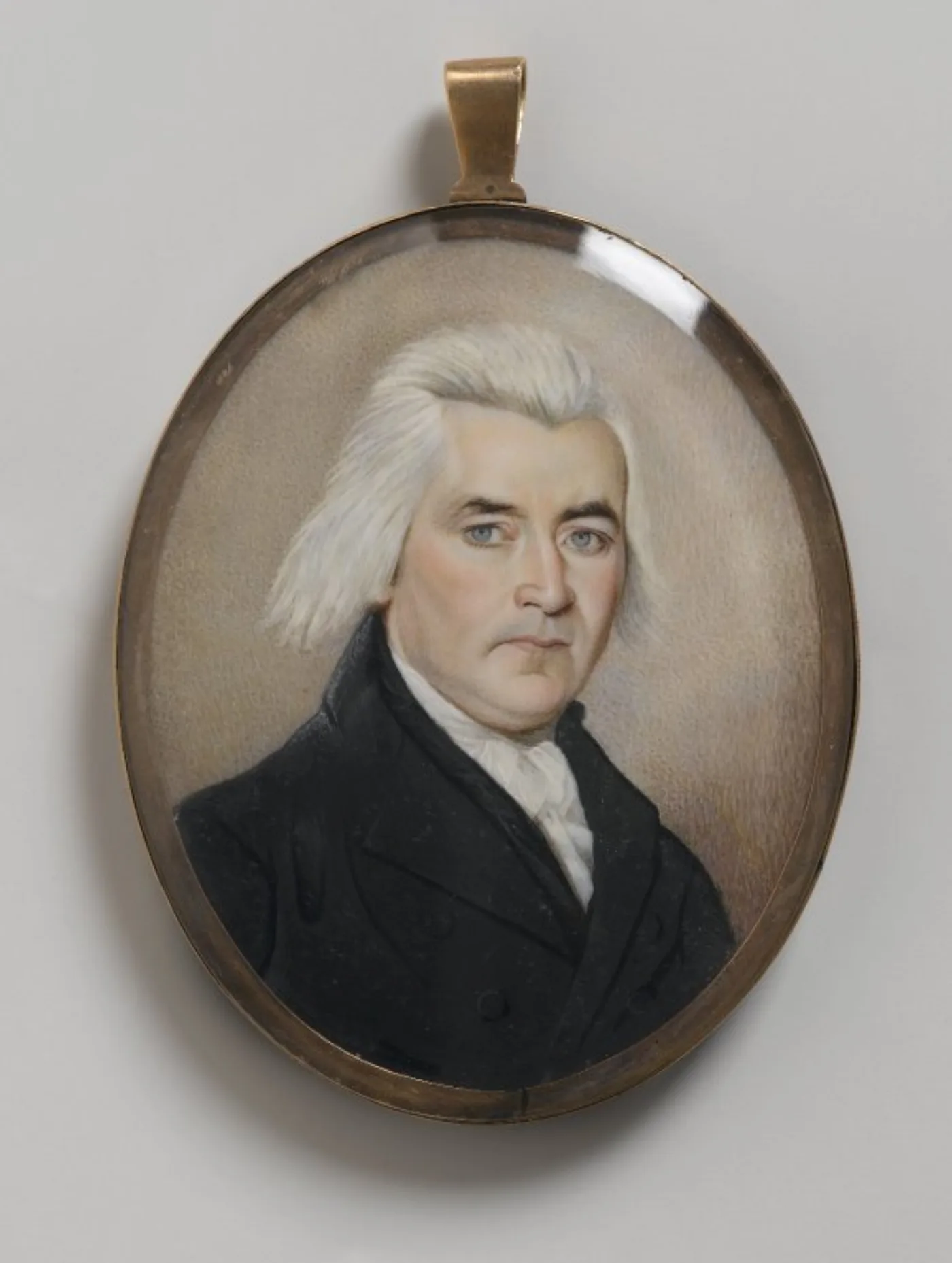 Late 18th-century American mourning miniature of a gentleman in an oval gold pendant
