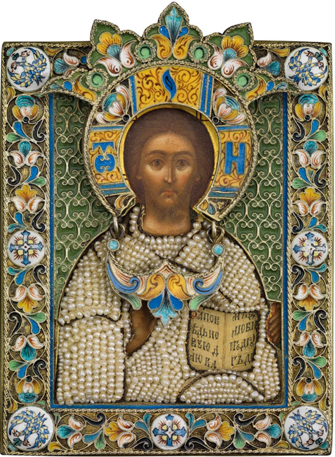 Small icon of Christ holding a book, the painted face and hands surrounded by a silver cover pierced to fit them, the cover enamelled in blue, green and white and set with seed pearls