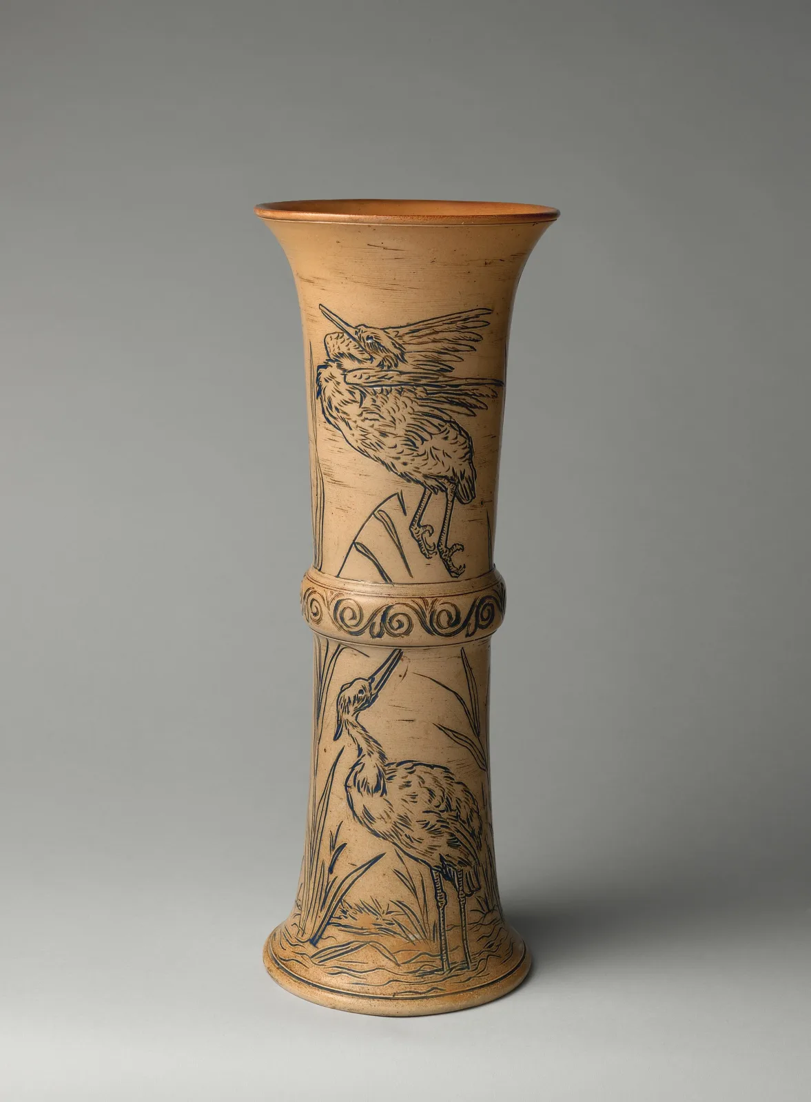 Tall flaring stoneware beaker vase in buff and blue-grey, its body incised with a frieze of grazing animals in fine line and banded above and below with rows of small applied beads