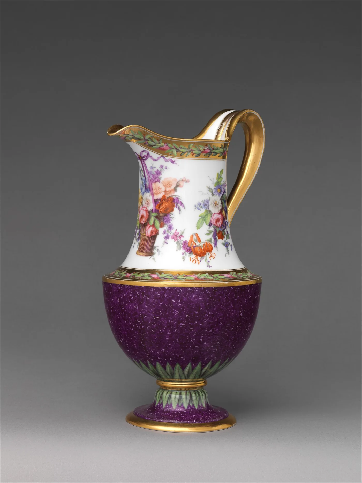 Sèvres ewer with a mottled violet lower body and a white neck painted with a basket of flowers, with a gilt handle and foot