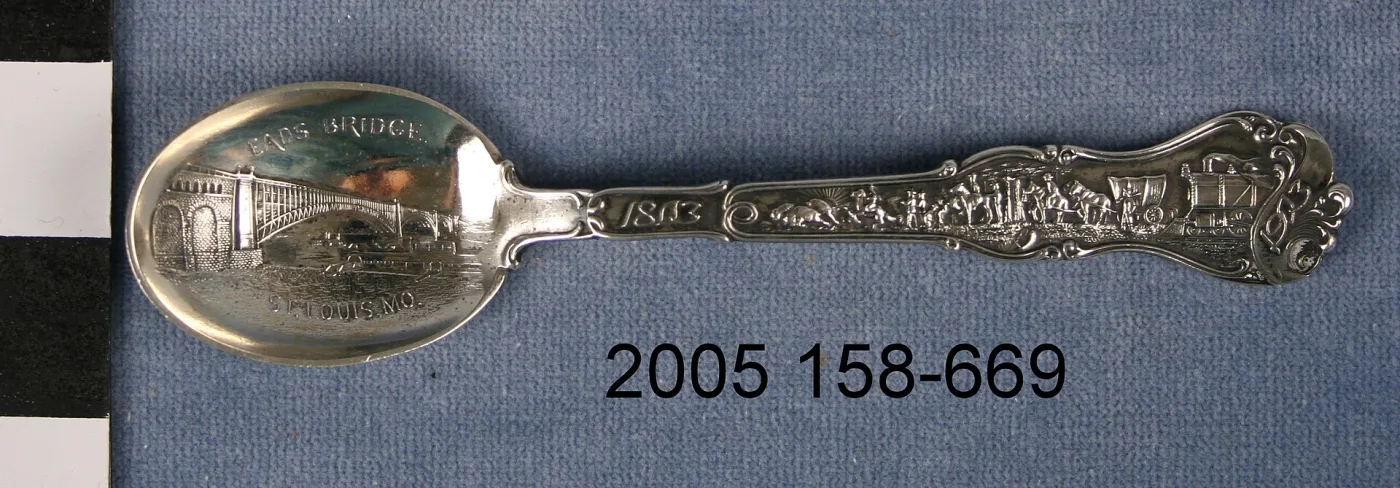 Souvenir spoon bowl with a bridge rendered in raised relief, lettered above and below within the same strike