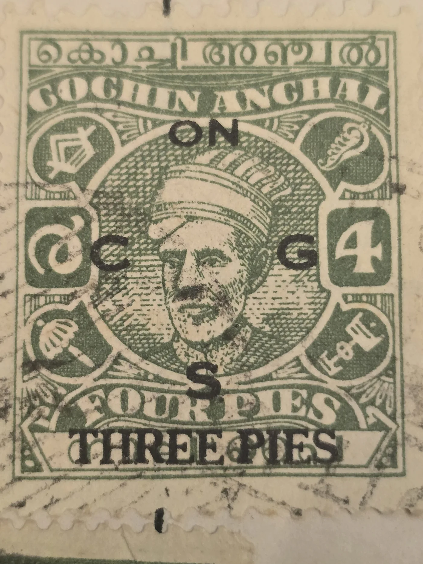 Green Indian princely state stamp with a ruler's portrait, Malayalam script across the top, the separate letters O, C, G and S overprinted in black around the portrait, and THREE PIES printed across the bottom over the original FOUR PIES