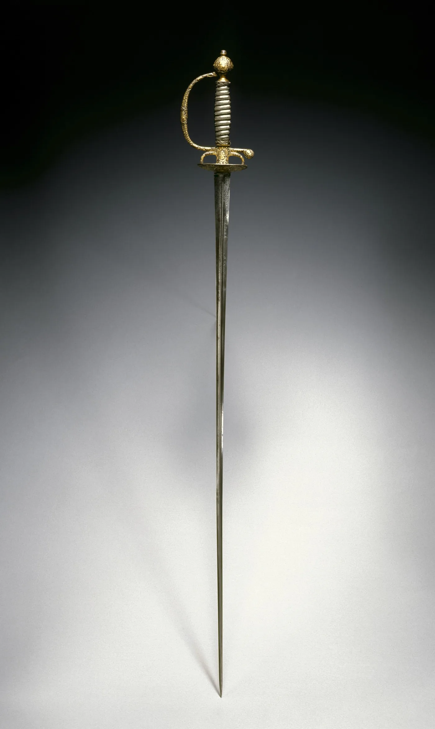 Full length view of an 18th-century Paris smallsword with a slender triangular blade