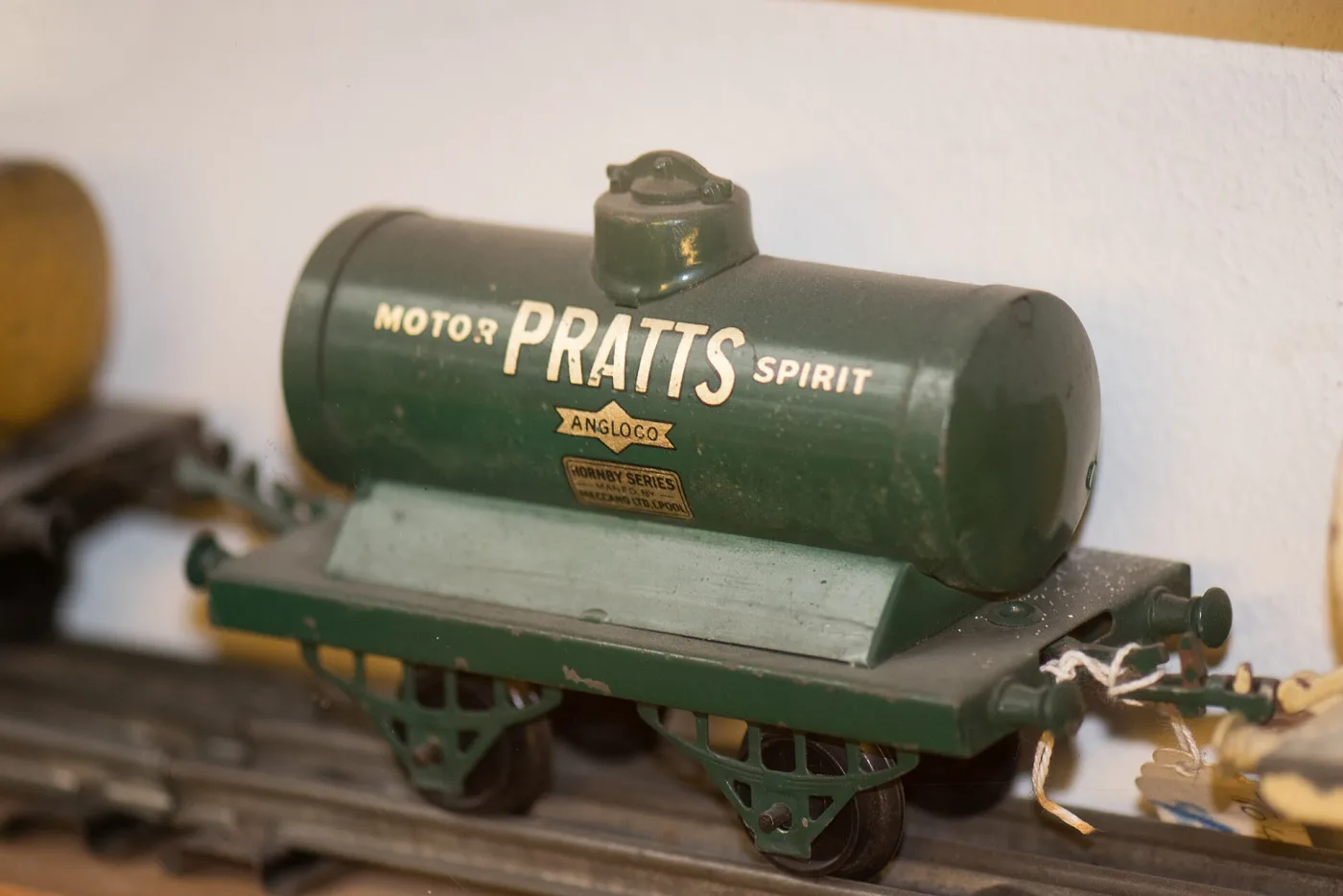 Green tinplate tank wagon lettered Pratts Motor Spirit with a small maker's transfer below the lettering