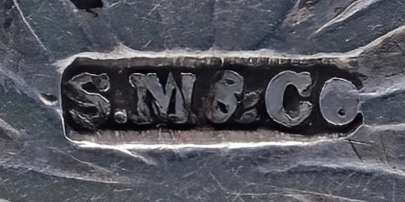 Maker's mark reading S M and Co struck in three joined oval punches on silver